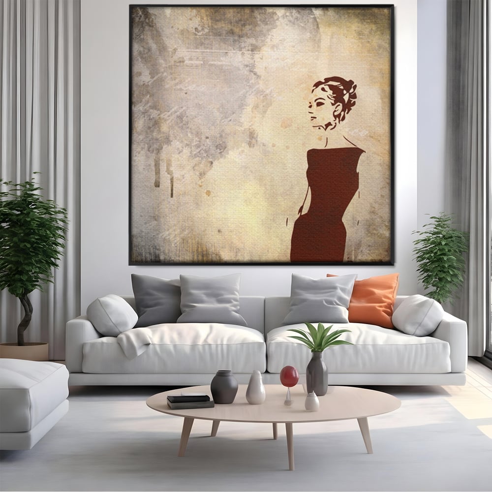 Tablou canvas cu ilustratie cu o femeie in rochie, in rama de aluminiu negru, pe perete intr-un living